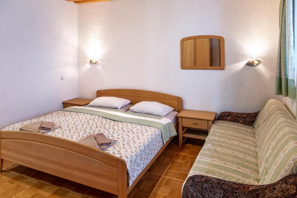 Postel nebo postele na pokoji v ubytování Gostišče Marin Miler