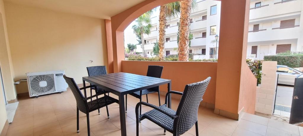 Balkón alebo terasa v ubytovaní Homes of Spain, Apartamentos Paraiso de Vera Playa, Ed Tahiti bajo F a pie de la playa, vistas piscina