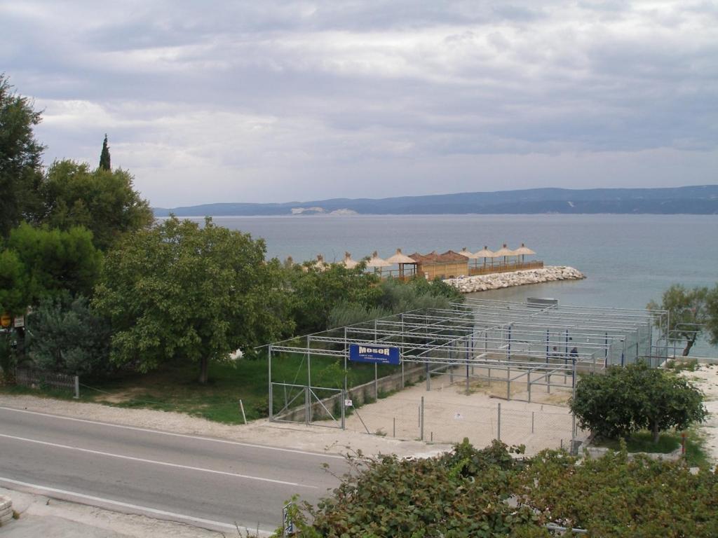 a view of a body of water next to a road at Apartments Duce-Golubinka (239) in Duće