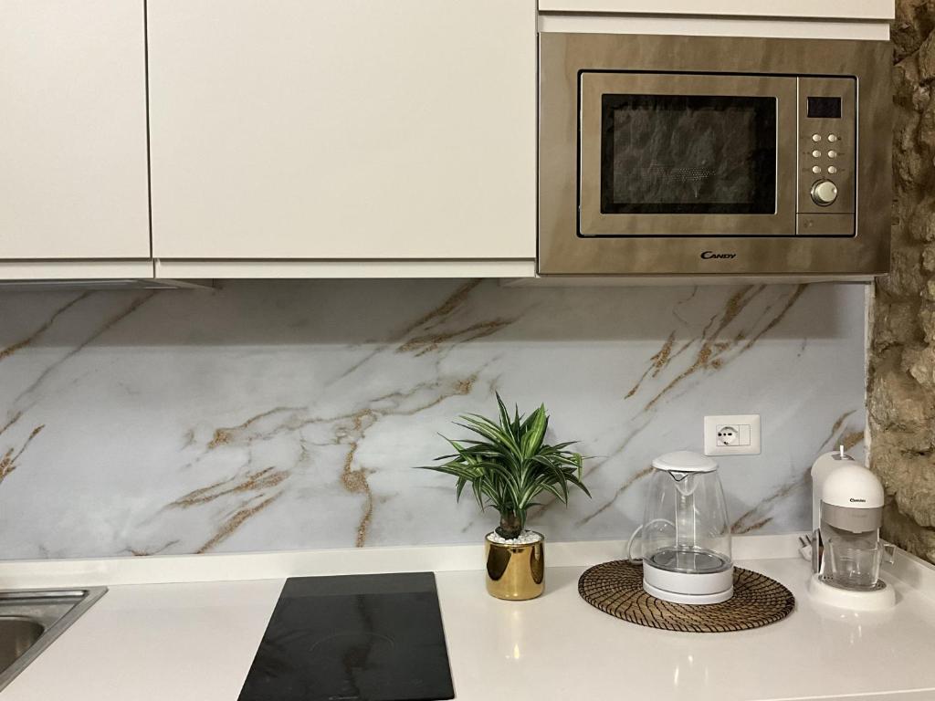 A kitchen or kitchenette at Rua 39 fine apartments by Dimore in Sicily