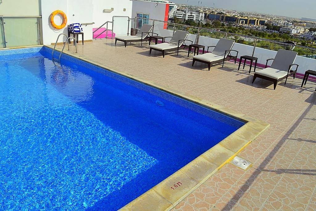 Bazén v ubytování Palm Inn Hotel Doha nebo v jeho okolí