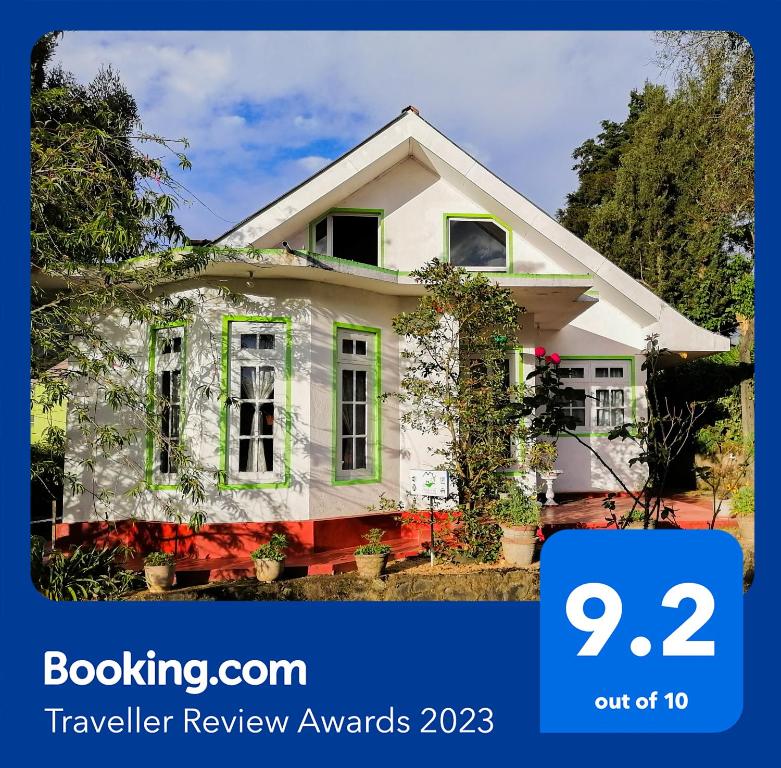 a house with the text booking a travel review awards at Nuwara eliya mountain view homestay in Nuwara Eliya