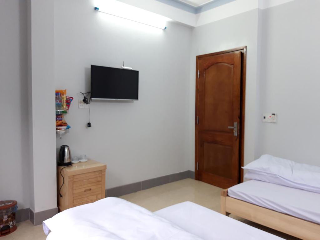Postel nebo postele na pokoji v ubytování NHÀ NGHỈ T&T
