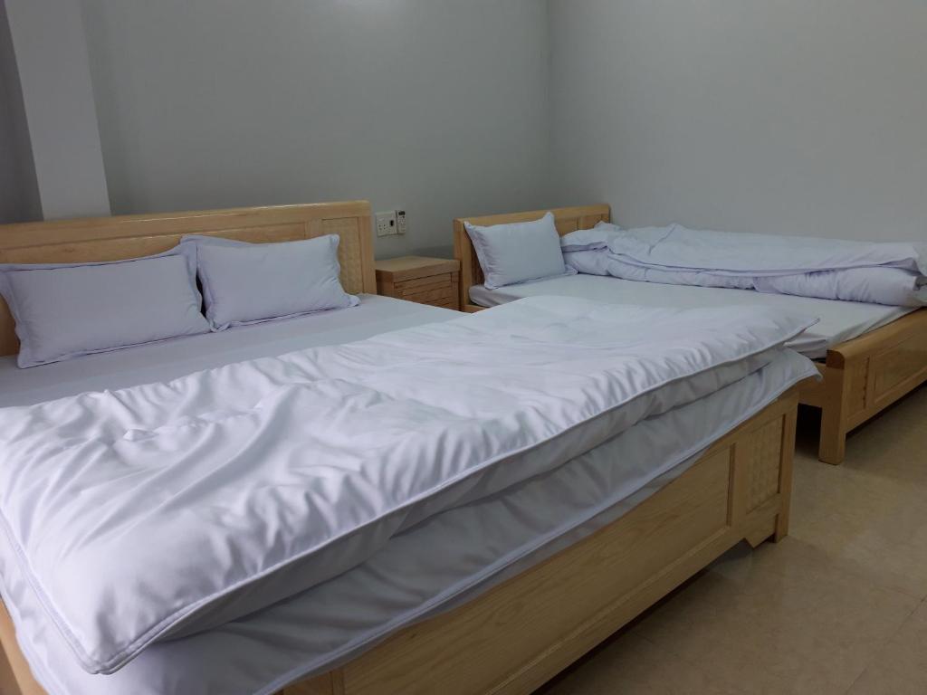Postel nebo postele na pokoji v ubytování NHÀ NGHỈ T&T