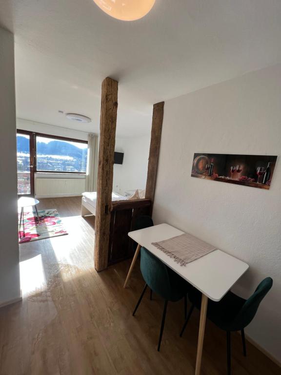 a living room with a white table and chairs at Wohnung Magdalena in Feldkirchen in Kärnten