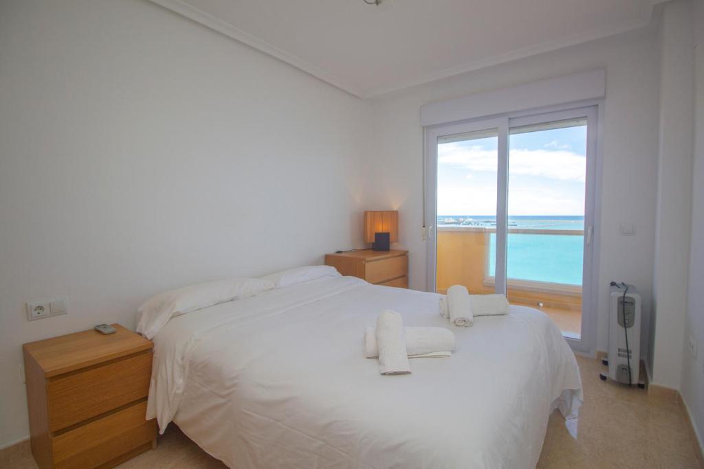 A bed or beds in a room at Spanish Connection - Playa Principe