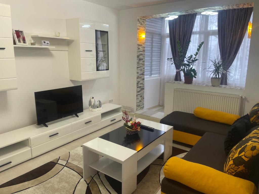Un televizor și/sau centru de divertisment la Apartament incantator