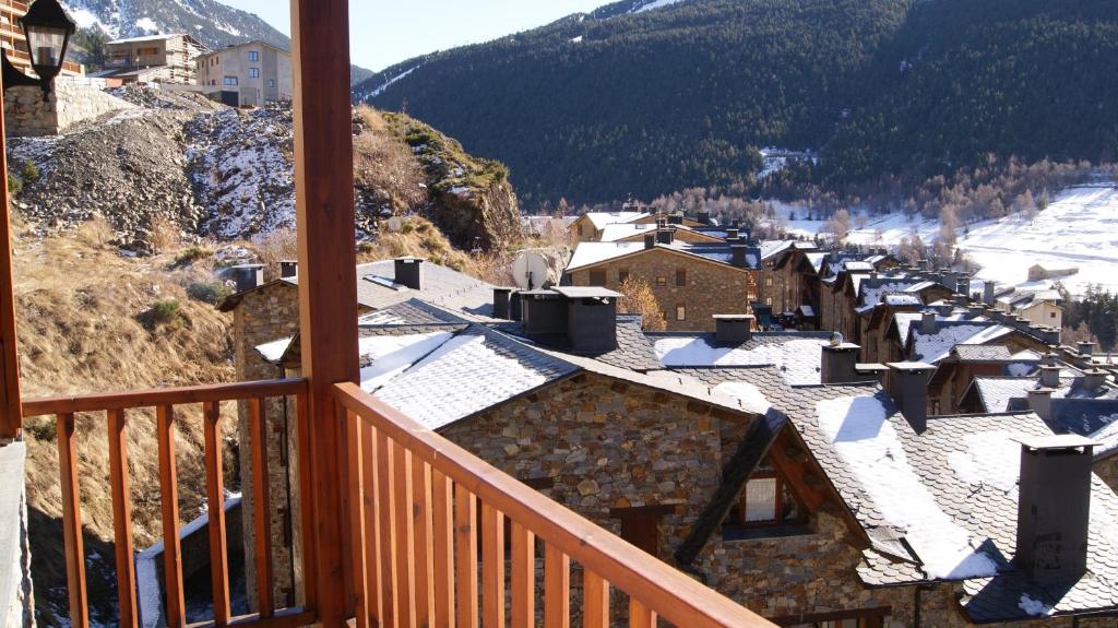 a view of a town with snow covered roofs at Soldeu Paradis Tarter Mig in El Tarter