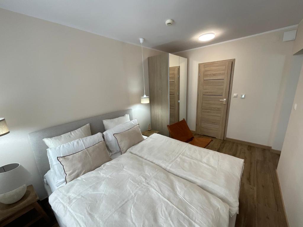 Posteľ alebo postele v izbe v ubytovaní HEARTH HILL VIEW APARTMENT