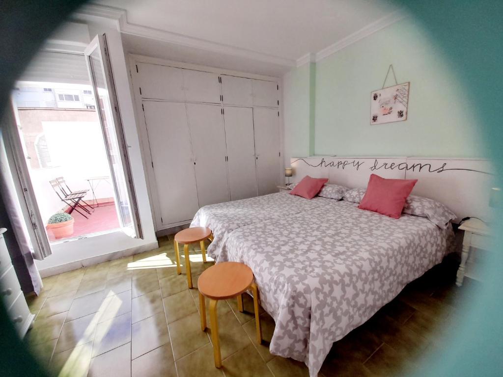 Postel nebo postele na pokoji v ubytování Estudio Carmen