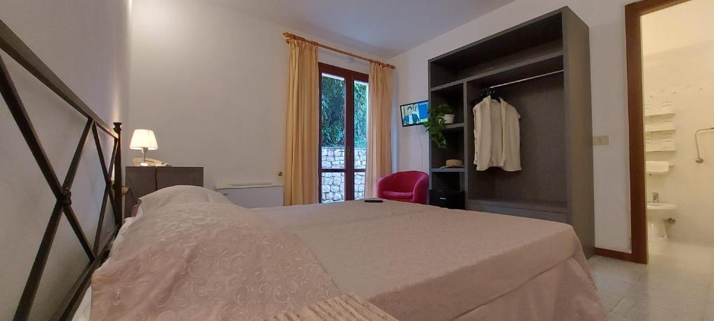Postel nebo postele na pokoji v ubytování Hotel La Feluca