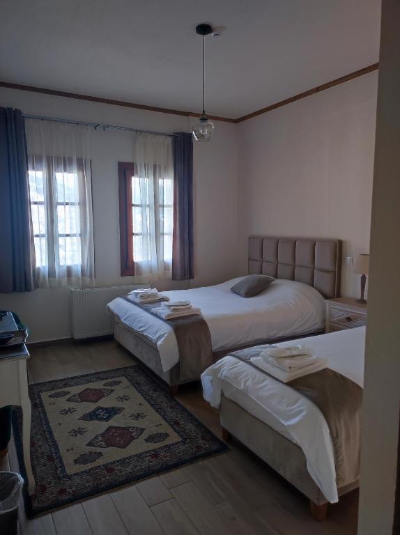 Postel nebo postele na pokoji v ubytování NUCA GUESTHOUSE