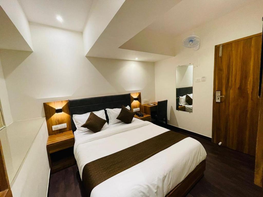 Postel nebo postele na pokoji v ubytování Hotel Hilton Suites