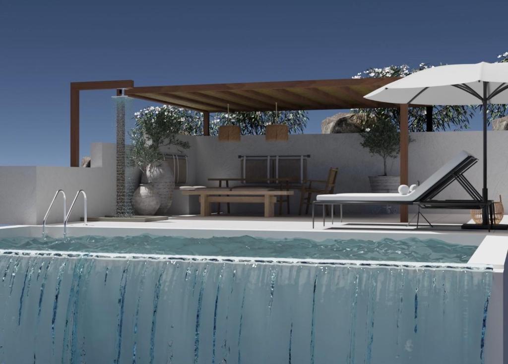 a swimming pool with a table and an umbrella at Villa Katerina in Punta