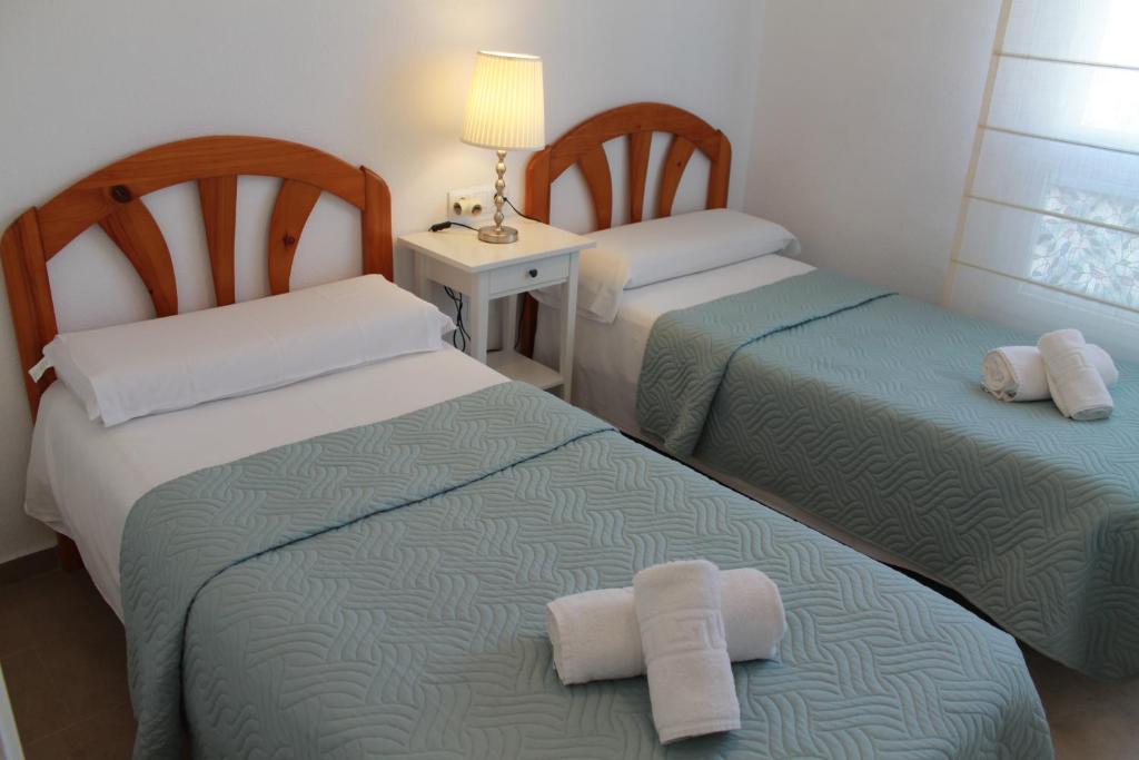 Posteľ alebo postele v izbe v ubytovaní Apartamento El Faro Leisure Port