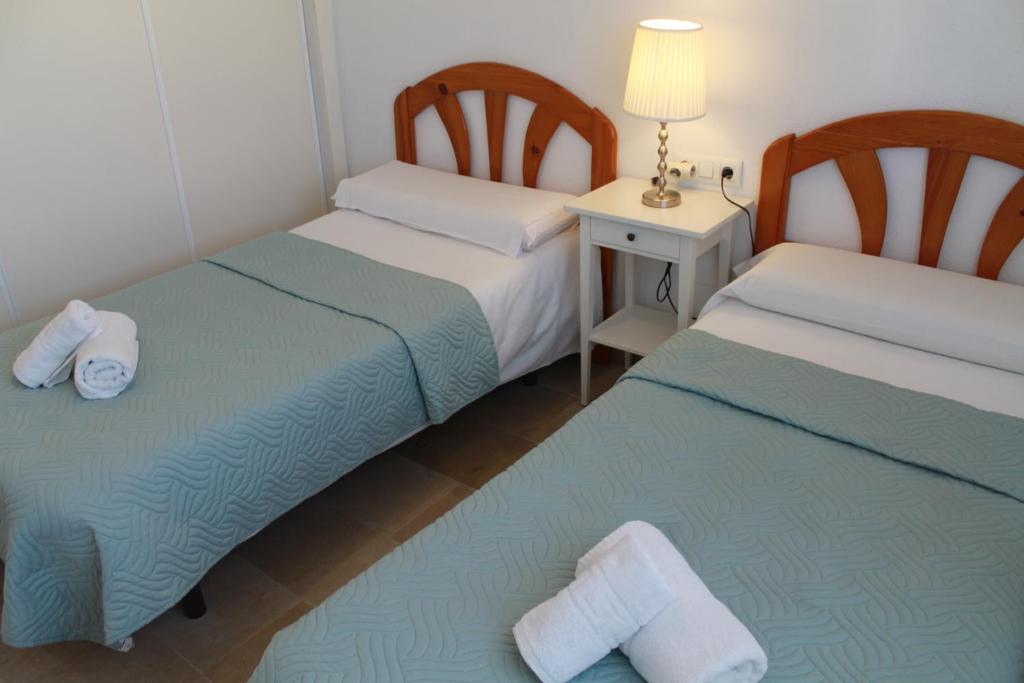 Posteľ alebo postele v izbe v ubytovaní Apartamento El Faro Leisure Port