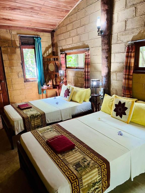 Postel nebo postele na pokoji v ubytování Kandy Eco Retreat