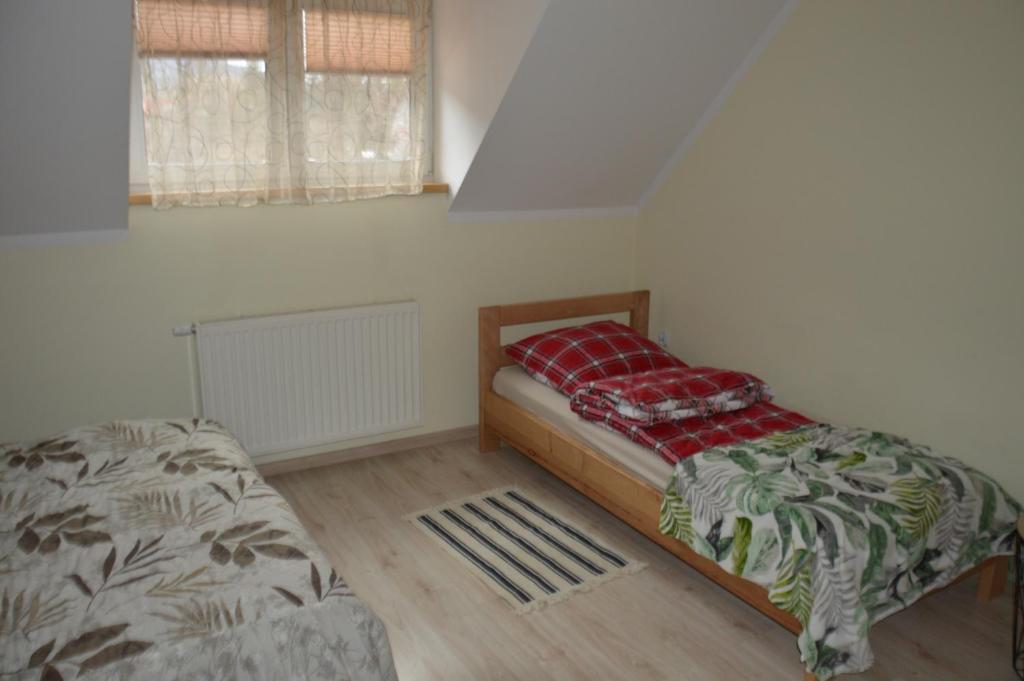 Posteľ alebo postele v izbe v ubytovaní Apartamenty Nad Górską Rzeką