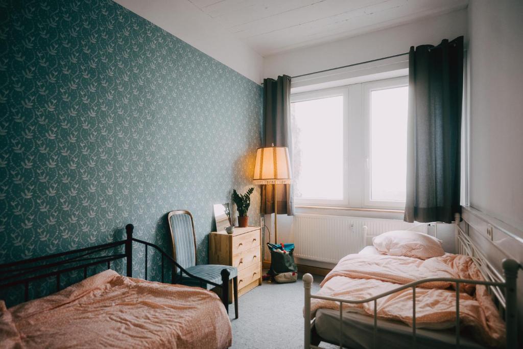 Postel nebo postele na pokoji v ubytování Hostel Très Schick