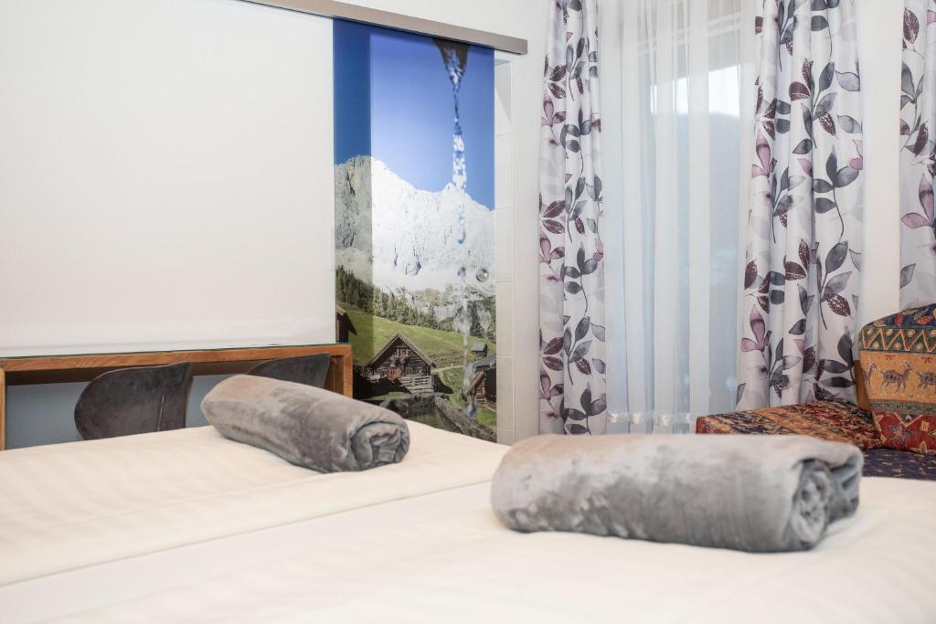Postel nebo postele na pokoji v ubytování Gästehaus Fuchs