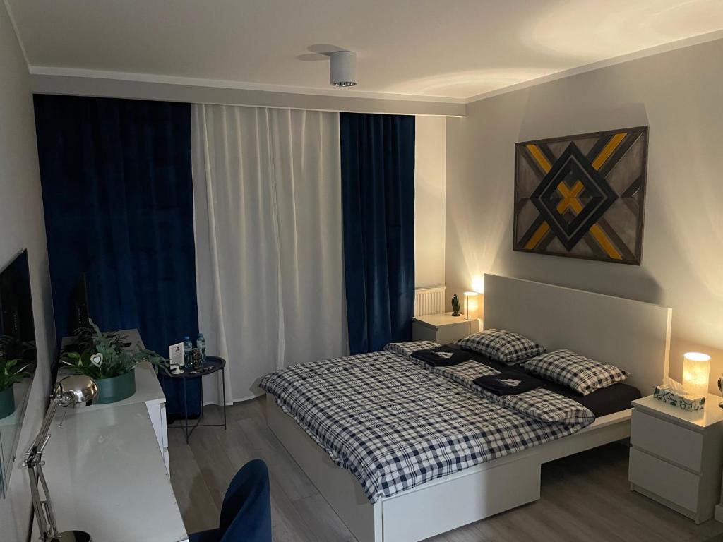 Postel nebo postele na pokoji v ubytování Apartament KORNER Chełmońskiego Śrem