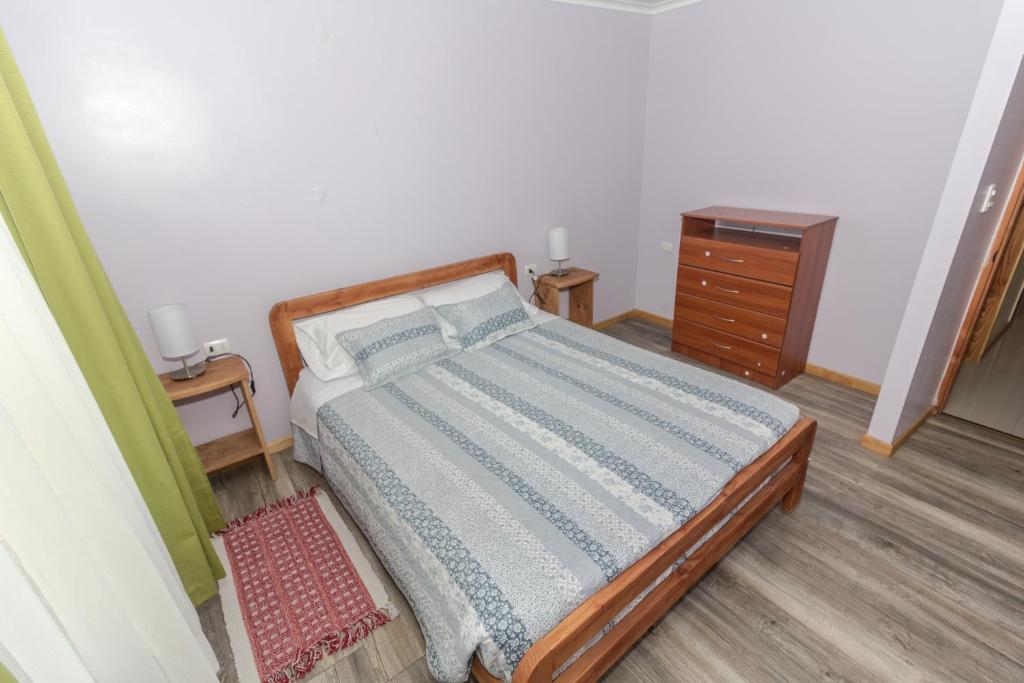 Postel nebo postele na pokoji v ubytování Apart Hotel Antu de Villarrica
