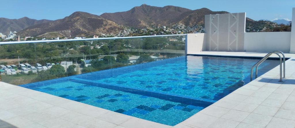 The swimming pool at or close to WiFi 300M, Parqueadero gratis, Piscina gratis, Llegada autónoma