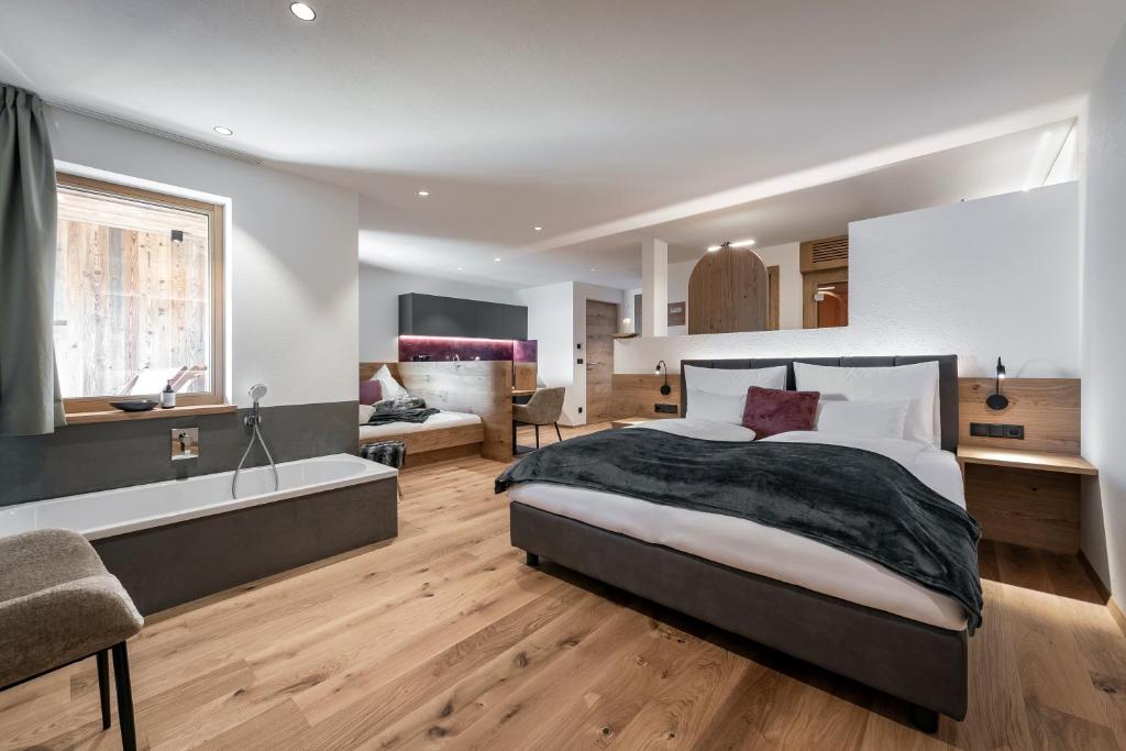 Postel nebo postele na pokoji v ubytování DILIA Chalets & Apartments