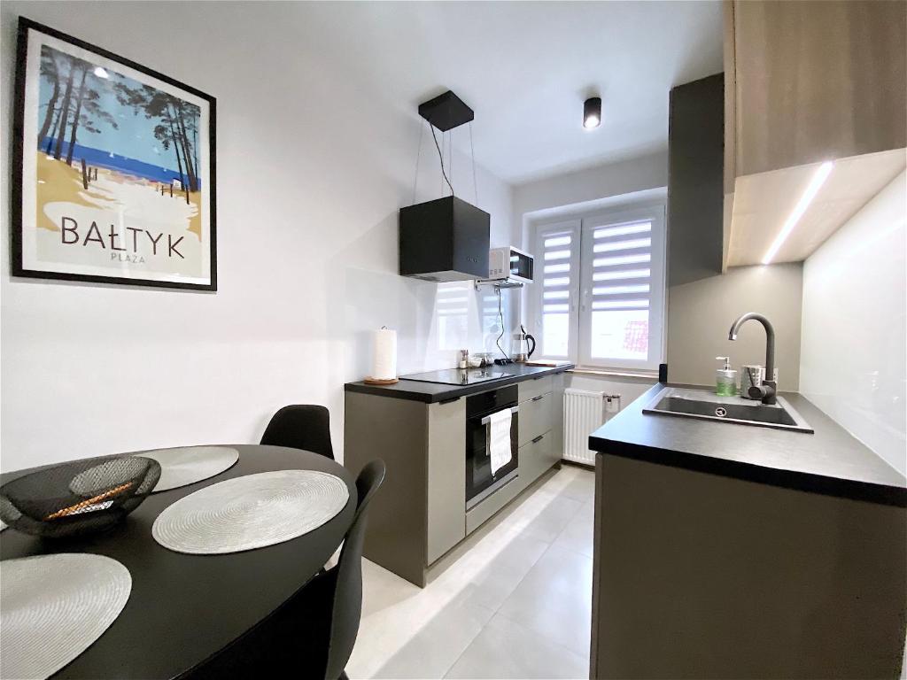 Kuchyňa alebo kuchynka v ubytovaní Apartamenty Marea Rentals Bałtyk Ustka