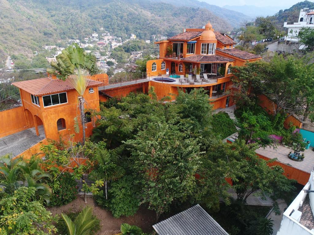 an aerial view of a large orange house at Orange Sunsets, Lush Landscape, Intown, Privacy in Puerto Vallarta