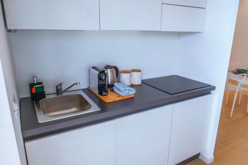 Kuchnia lub aneks kuchenny w obiekcie Rossani Suites&Aparts