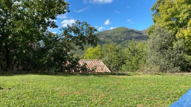 a house in the middle of a field at La Peyreyre in Jaujac