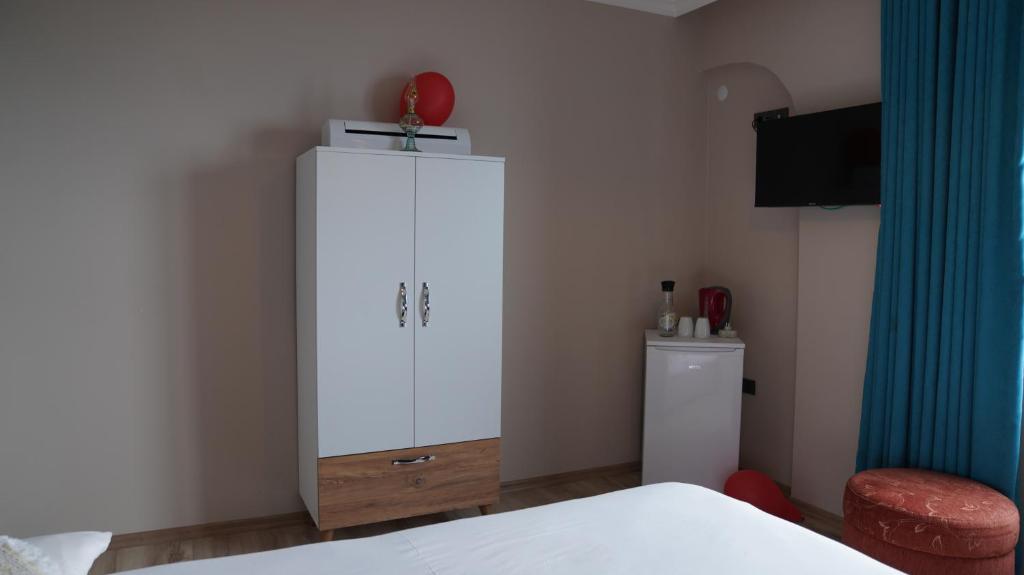 Postel nebo postele na pokoji v ubytování AKDAĞ KEMER OTEL