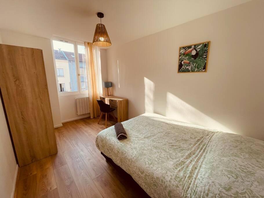 Posteľ alebo postele v izbe v ubytovaní Bel Appart' 4 chambres duplex Durafour
