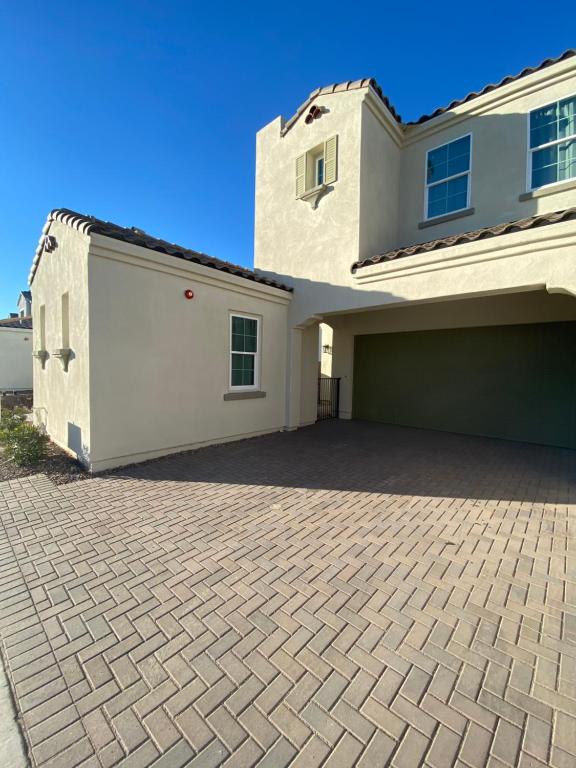 a large white house with a garage at AZ Chandler Rental in Chandler