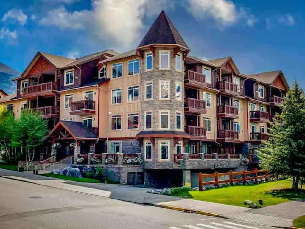 an exterior view of a large apartment building at Mountain View 1 BR Condo With Gym & Hot-Tubs in Canmore