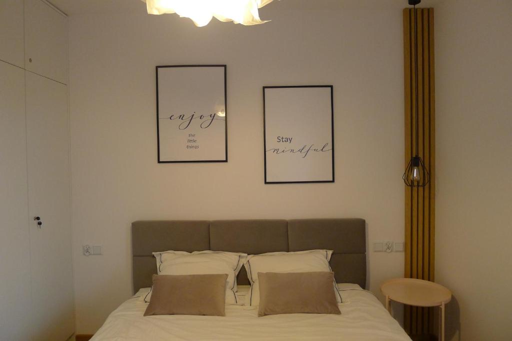 Posteľ alebo postele v izbe v ubytovaní Apartament Loft