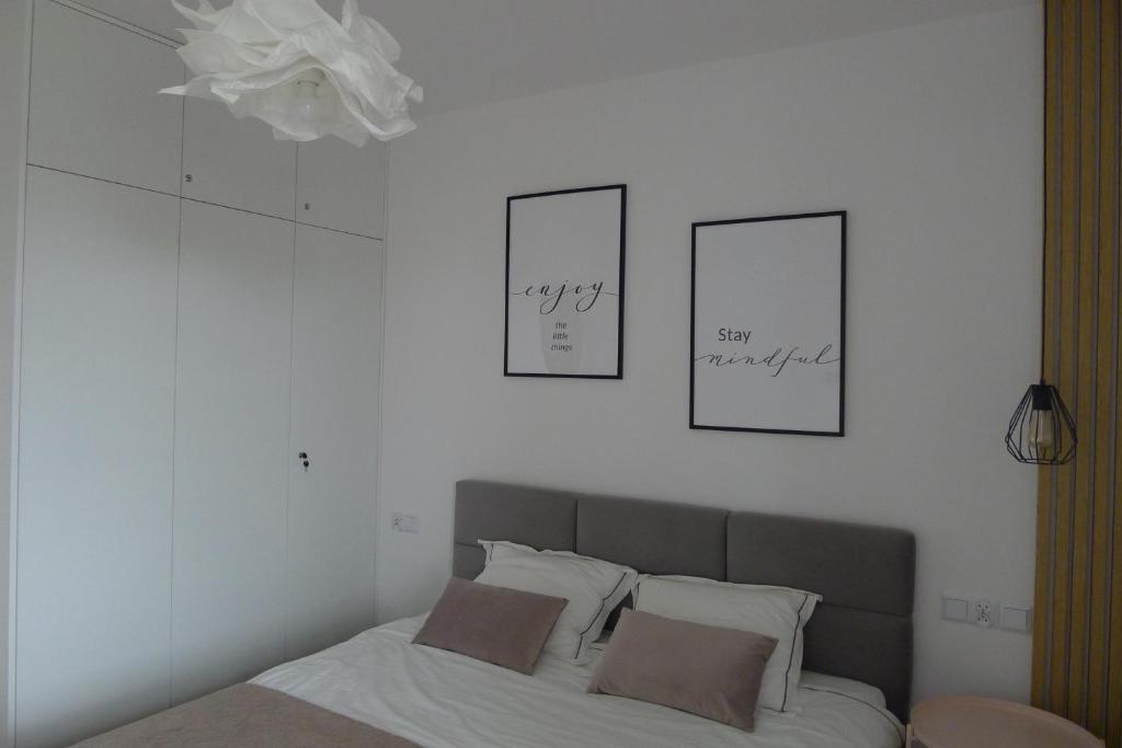 Posteľ alebo postele v izbe v ubytovaní Apartament Loft
