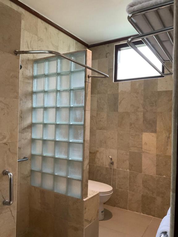 Koupelna v ubytování Grand Kumala Hotel - Hotel Kumala Legian Kuta Bali