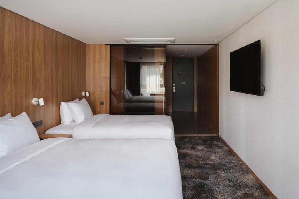 Postel nebo postele na pokoji v ubytování Hotel tt Gupo