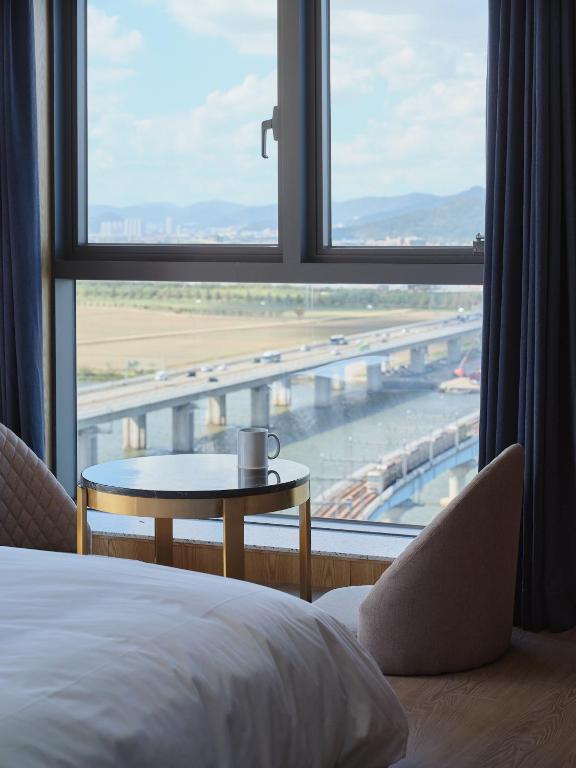 Postel nebo postele na pokoji v ubytování Hotel tt Gupo