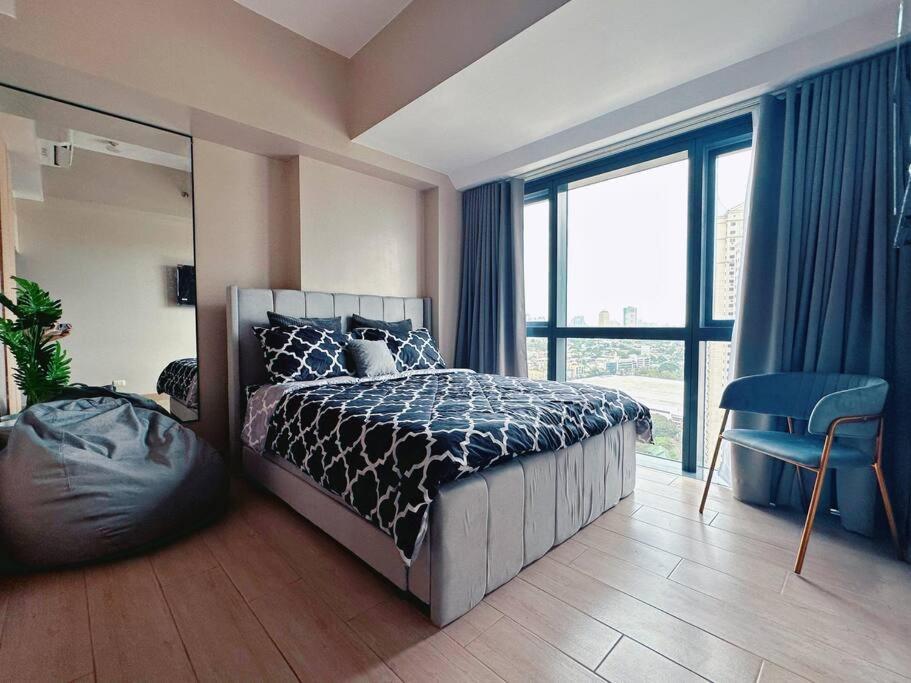 En eller flere senge i et værelse på Eastwood High Life - Spectacular City View