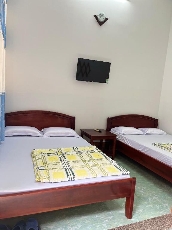 Postel nebo postele na pokoji v ubytování Hotel Minh Vy