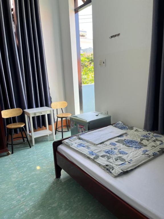 Postel nebo postele na pokoji v ubytování Hotel Minh Vy