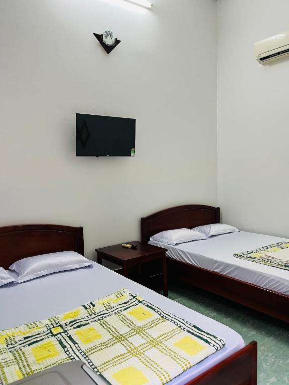 Postel nebo postele na pokoji v ubytování Hotel Minh Vy