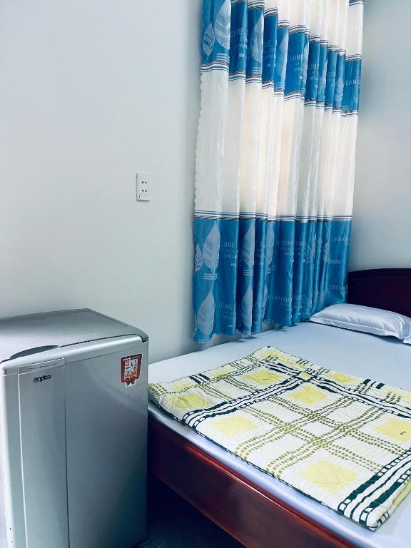 Postel nebo postele na pokoji v ubytování Hotel Minh Vy
