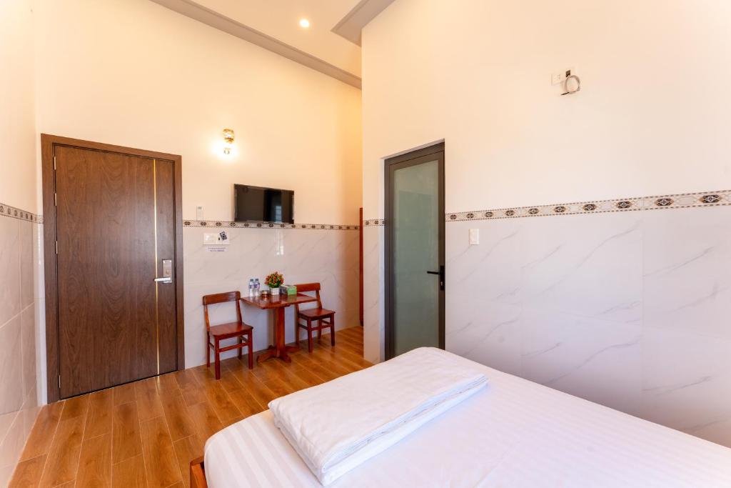 Postel nebo postele na pokoji v ubytování Homestay Bảo Châu - Nhơn Lý Quy Nhơn