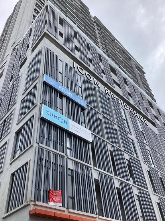 a tall building with a sign on the side of it at Golden Oceanview at Icon Residence in Kuala Terengganu