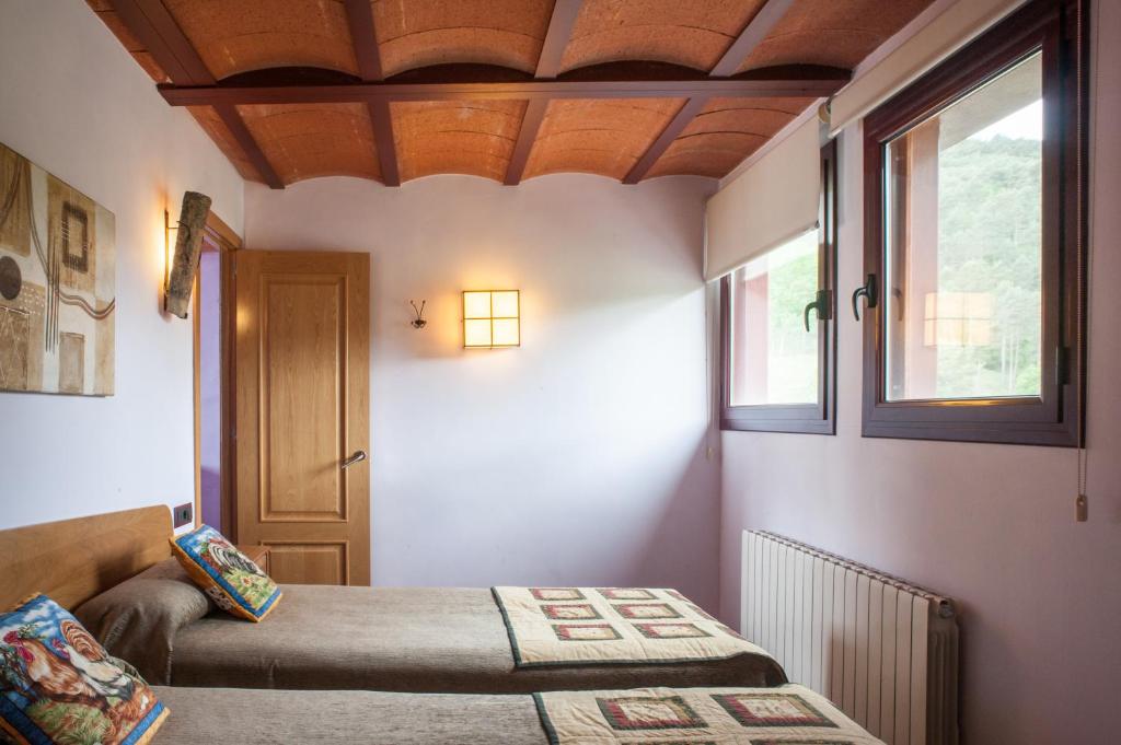 Postel nebo postele na pokoji v ubytování Mas La Riera