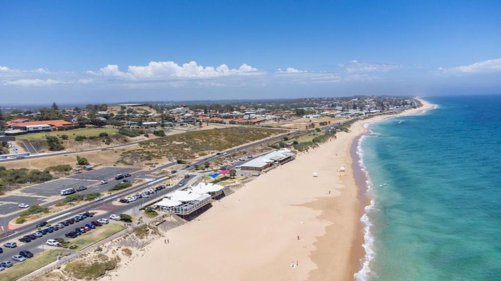 an aerial view of a beach and the ocean at Beachside Townhouse Bunbury in Bunbury